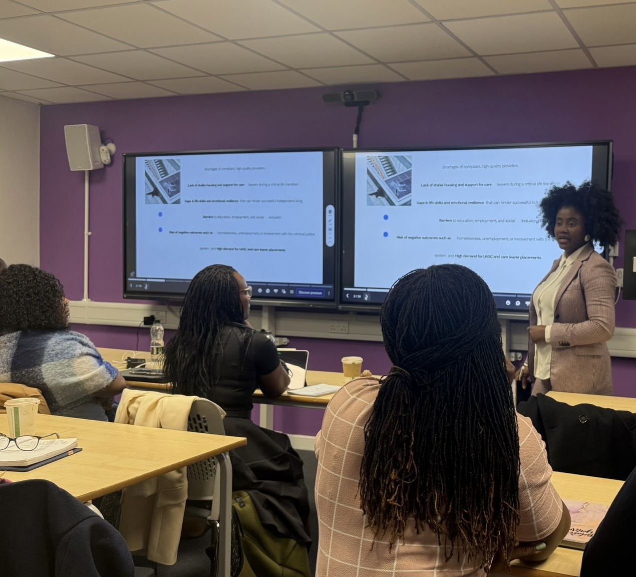 Kemi Areola delivering leadership training to a room of professionals
